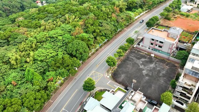 Beautiful highway and mountain road with many houses in 4K aerial view
