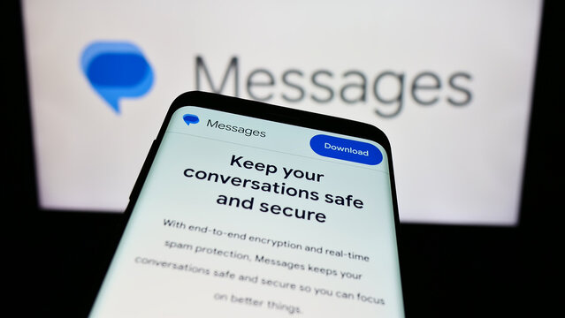 Stuttgart, Germany - 09-23-2023: Mobile phone with webpage of instant messaging app Google Messages on screen in front of business logo. Focus on top-left of phone display.