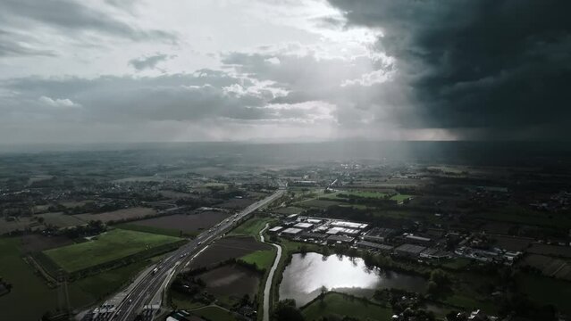 Aerial view of stormy skies over an Italian highway.
