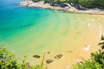 Aerial view of beaches surrounding Santander Spin during summer