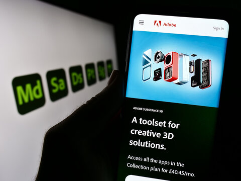 Stuttgart, Germany - 09-23-2023: Person holding cellphone with website of software product Adobe Substance 3D on screen in front of logo. Focus on center of phone display.