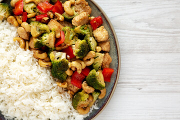 Homemade Cashew Chicken Stir-Fry on a Plate, top view. Flat lay, overhead, from above. Copy space.