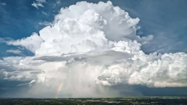 Aerial view: Italy's countryside shrouded in stormy drama as menacing clouds gather.
