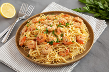 Baked Shrimp Scampi Linguine Pasta with Parsley on a Plate, side view.
