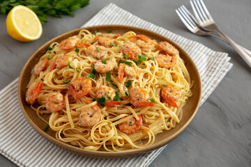 Baked Shrimp Scampi Linguine Pasta with Parsley on a Plate, side view. Close-up.