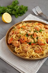Baked Shrimp Scampi Linguine Pasta with Parsley on a Plate, side view. Close-up.