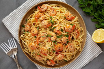 Baked Shrimp Scampi Linguine Pasta with Parsley on a Plate, top view. Flat lay, overhead, from...
