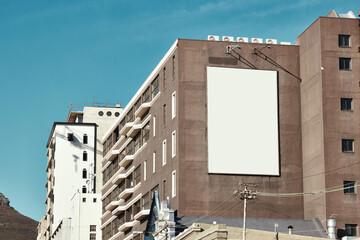 Building, mockup space and advertising banner, commercial product or logo design in city. Empty...