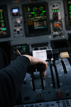Pilot operating airplane in cockpit