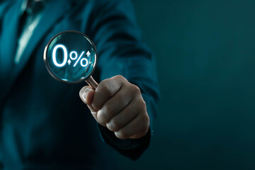 Businessman shows rising interest rate from magnifying glass Increased credit, business, banks,...
