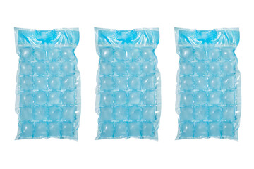 Blue plastic packaging ice bags for home water freezing isolated on white background. Ice cubes in...