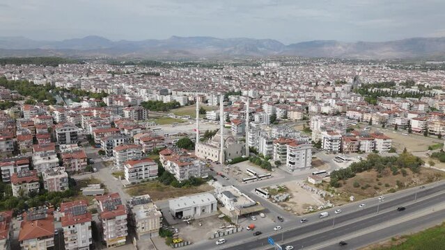 Panoramic aerial view across Manavgat mosque minaret towers, Largest in the Antalya region on the urban skyline of Turkey