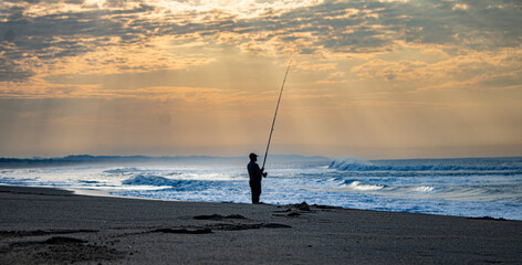 Lone Fisherman on the Beach