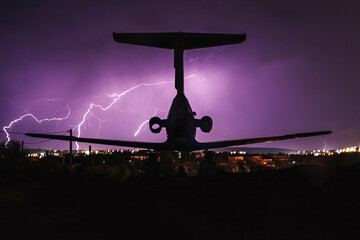 Abandoned plane in the evening, thunder and sparkle