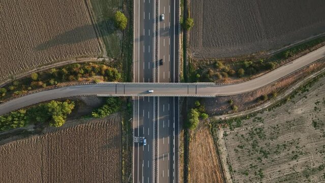  Overhead aerial of a highway bridge italien roads sunny morning