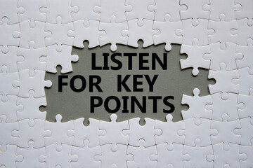 Key points symbol. White puzzle with words Listen for Key points. Beautiful grey background. Business and Listen for Key points concept. Copy space.