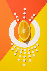 Vitamin C in citrus fruits, on an orange background.