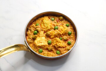 Famous Indian curry dish Paneer matar masala. vegetarian North Indian dish consisting of peas and paneer in a tomato based sauce, spiced with indian spices and garam masala. peas and cottage cheese. 