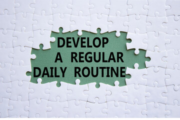 Daily routine symbol. Concept words Develop a regular daily routine on white puzzle. Beautiful grey green background. Business and Develop a regular daily routine concept. Copy space.