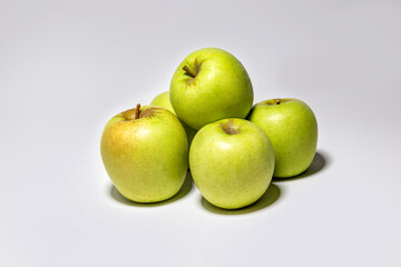 green yellow apples on a white background
