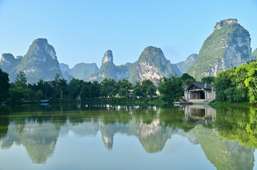 Karst Landscape of Mingshi Pastoral with Reflection on Water in Guangxi Region, China