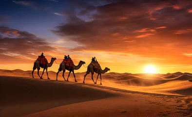 Foto op Plexiglas A caravan of camels walking through the desert at sunset. © lutsenko_k_