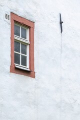 window on the wall of an old castle	
