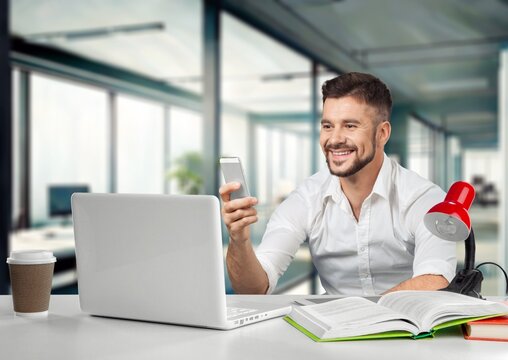 Male business manager using phone in office, AI generated image