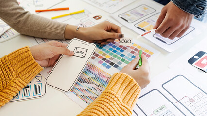 team of UI UX web designer are working together to develop mobile responsive websites with UI UX...