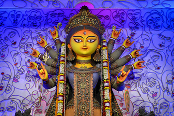 Idol of Goddess Devi Durga at a decorated puja pandal in Kolkata, West Bengal, India. Durga Puja is...