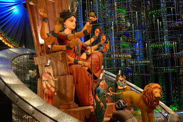 Idol of Goddess Devi Durga at a decorated puja pandal in Kolkata, West Bengal, India. Durga Puja is...