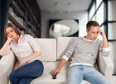 Young cad couple On Couch At Home, Conflicts And Problems, AI generated image