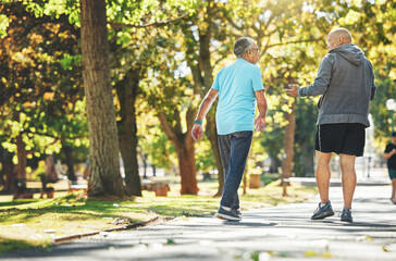 Fitness, walking and elderly men in park for wellness, healthy body and wellbeing in retirement,...