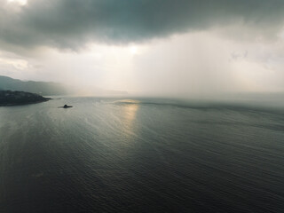 Obraz premium Aerial view of storm clouds with ocean landscape in the morning