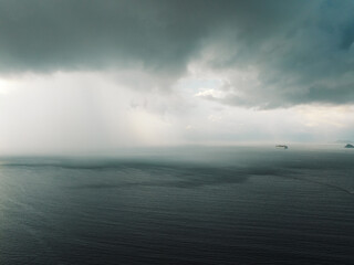 Aerial view of storm clouds with ocean landscape in the morning