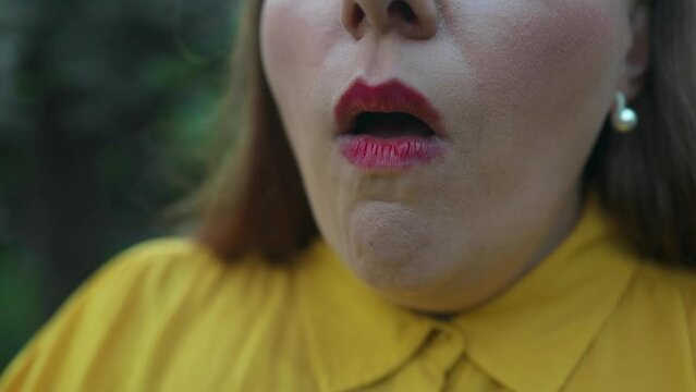 Sick young female standing outdoor and coughing and sneezing. Close up portrait of unwell beautiful Caucasian woman coughs and having pain in chest. Infection and virus. Health concept. High quality