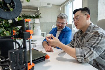 Scientists involved in setting up and developing 3D printers in the modern laboratory.