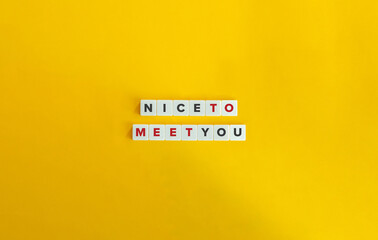 Nice To Meet You Phrase and Concept. Letter Tiles on Yellow Background. Minimal Aesthetic.