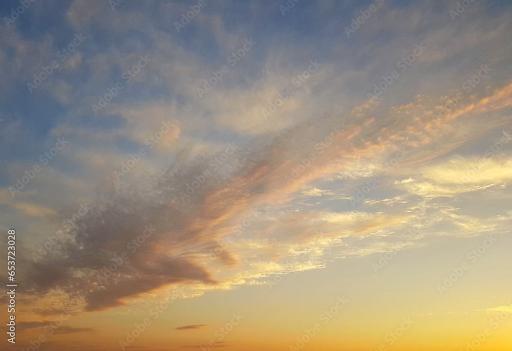 Wall mural dinamic colorful sunset sky with cloud. summer gold cloudy skyline