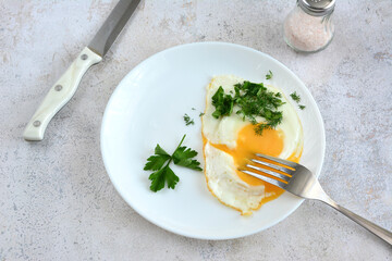 healthy protein breakfast with fried egg and chopped parsley copy space  