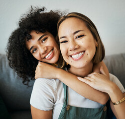 Lesbian, couple and portrait of hug on sofa in home, living room or apartment with love, support...