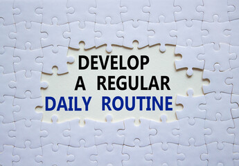 Daily routine symbol. Concept words Develop a regular daily routine on white puzzle. Beautiful white background. Business and Develop a regular daily routine concept. Copy space.