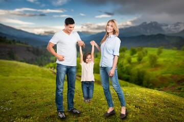 Happy young parents and child walking