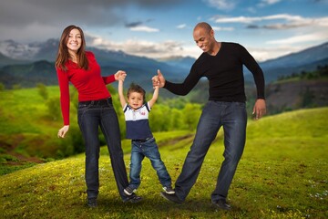 Happy young parents and child walking