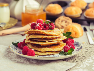 Palatable pancakes with berries served on table