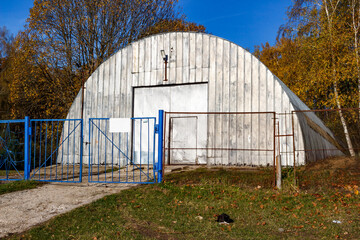 Hangar for storage on the territory behind the fence