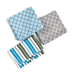 Napkins and towels on white background. Kitchen textiles, top view