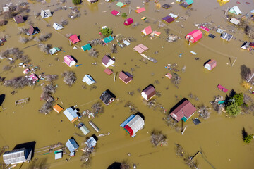Houses flooded during the spring flood in the countryside, aerial view