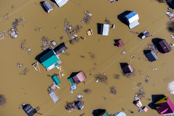 Houses flooded during the spring flood in the countryside, aerial view
