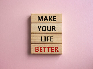 Make your Life Better symbol. Concept word Make your Life Better on wooden blocks. Beautiful pink background. Business and Make your Life Better concept. Copy space